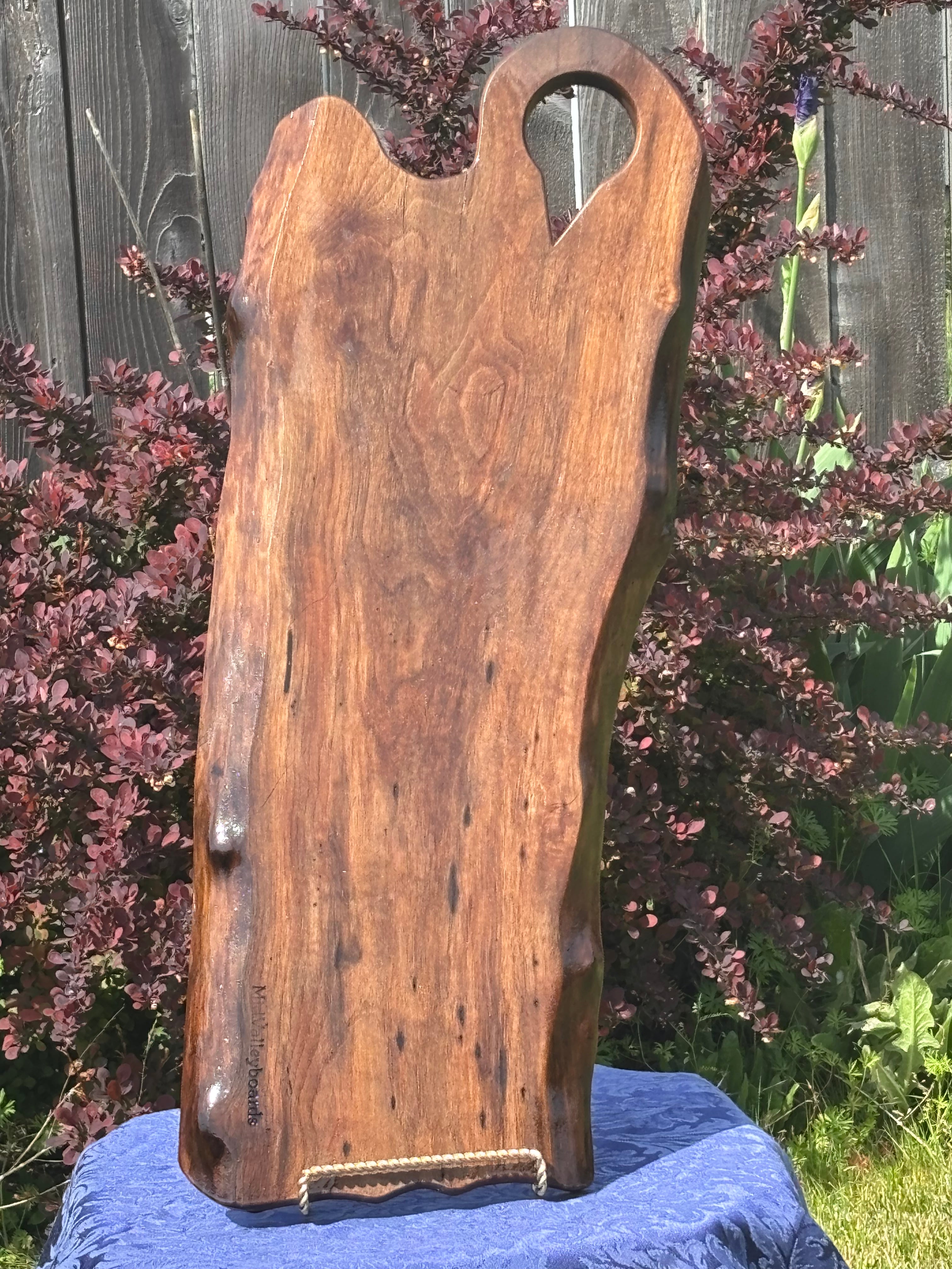 Black walnut live edge charcuterie board with keyhole handle