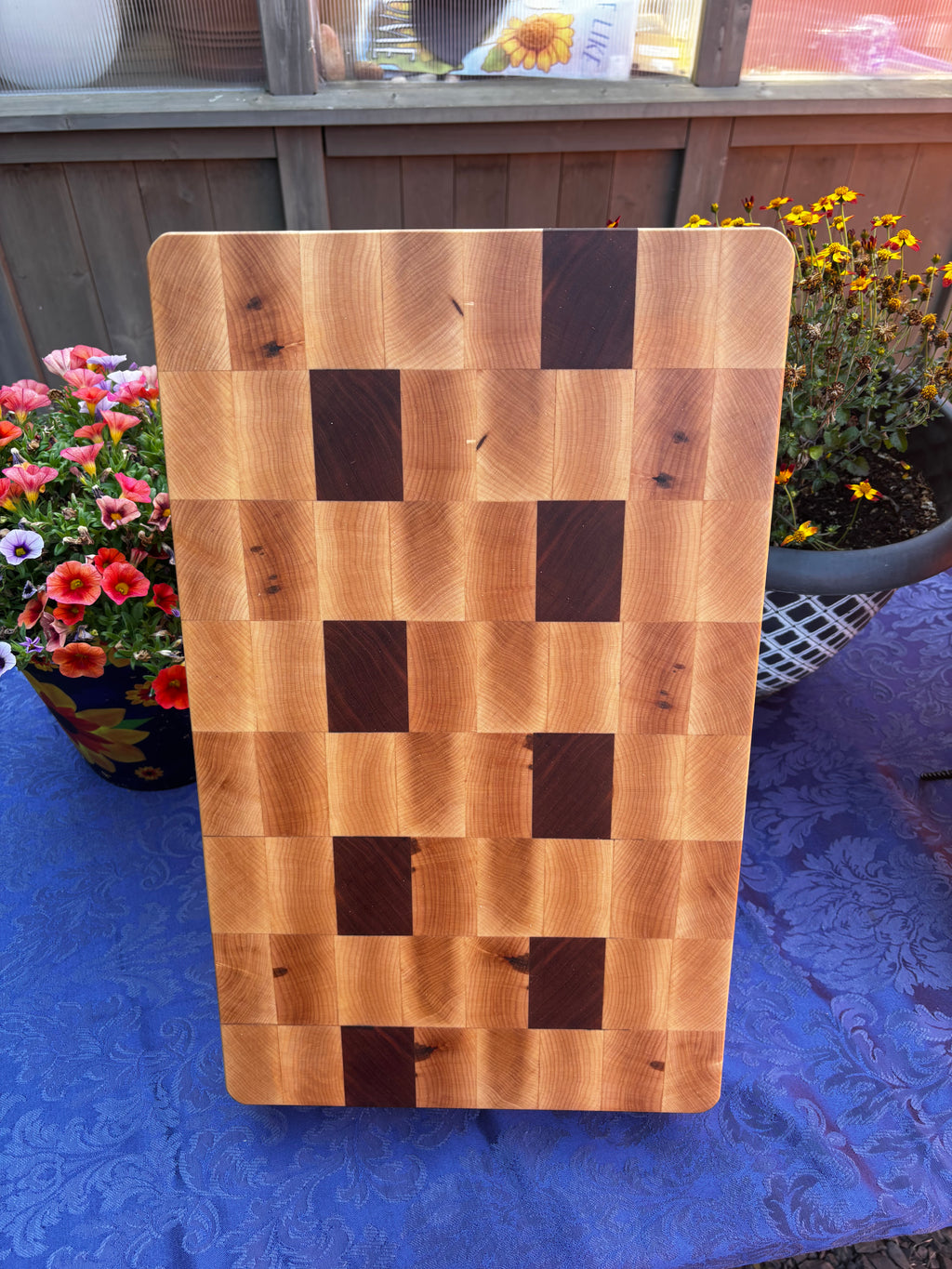 Maple and Cherry in a end grain orientation and "butcher block" style. For those that want the thickness of a butcher block without the larger size and weight.