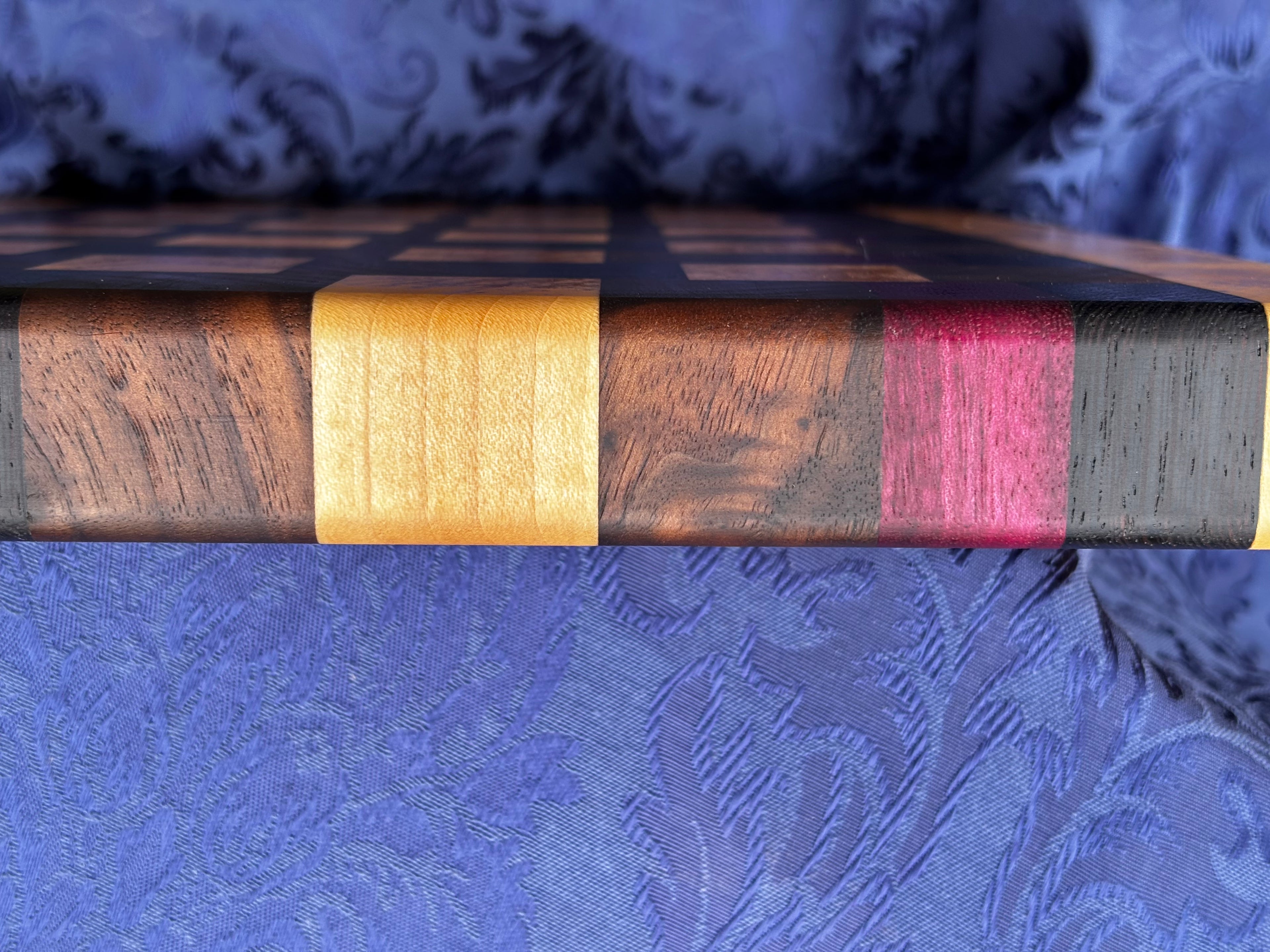 The grain is so rich and dark that it is hard to tell from the pictures what the grain looks like. Here is a sample view from the edge that gives you a peek at what the grain looks like.